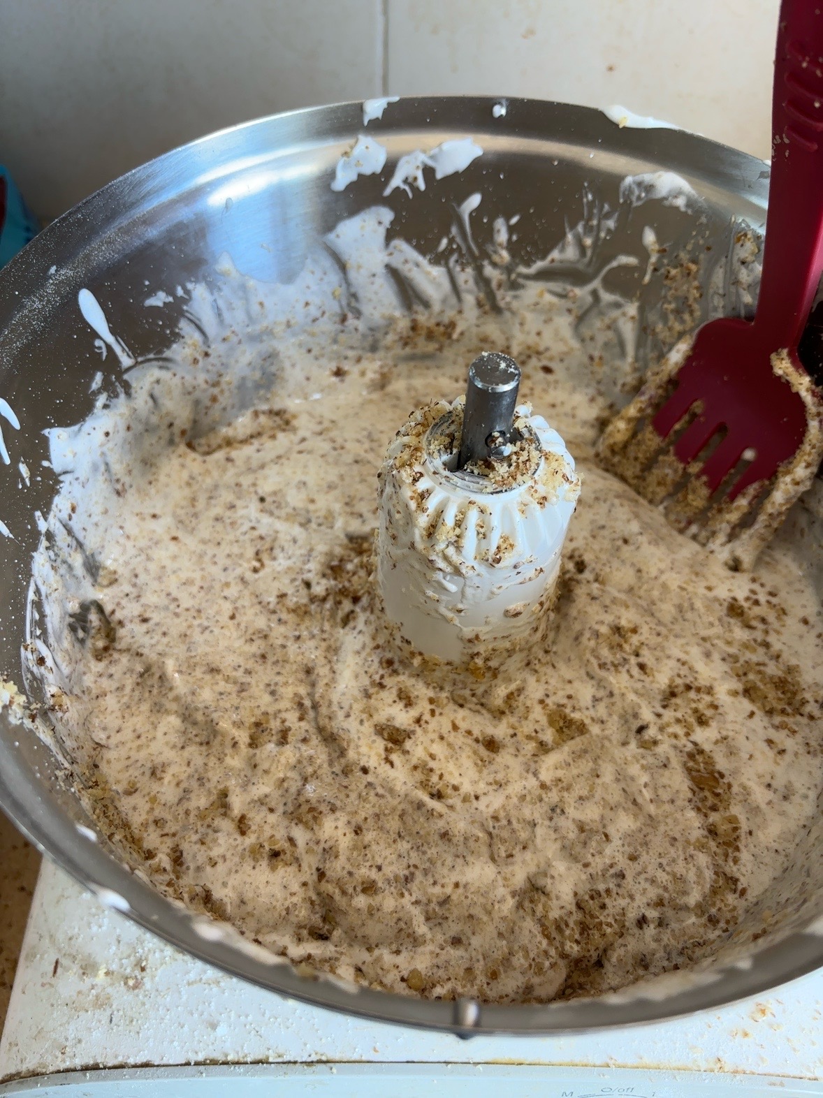 Folding the ground walnuts into the meringue