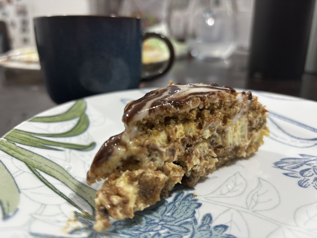 A slice of the finished Esterhazy torte served with coffee
