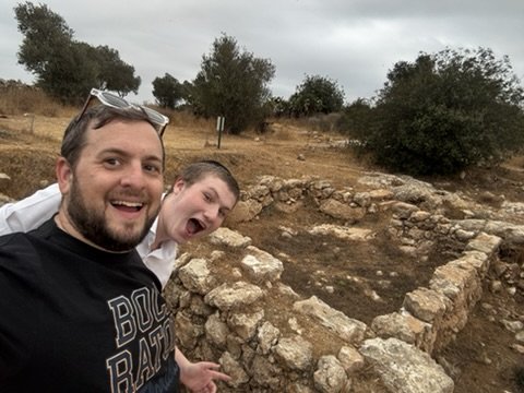 A goofy selfie beside ancient stone walls